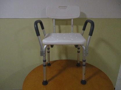Shower chair with backrest and arms