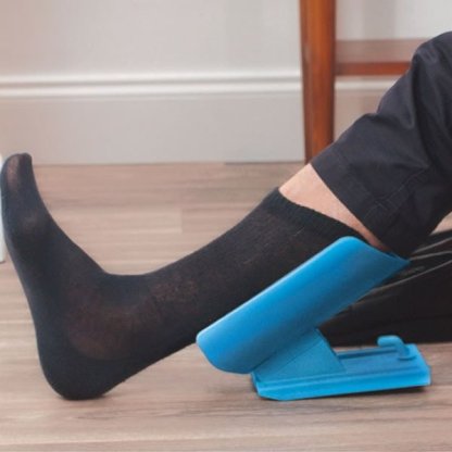 blue sock slider helping put on a black sock
