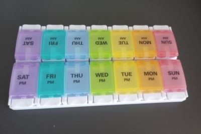 Rainbow-colored one-week pill dispenser